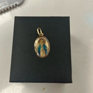 10 k yellow gold 1/2 in x 3/4 in mother Mary charm